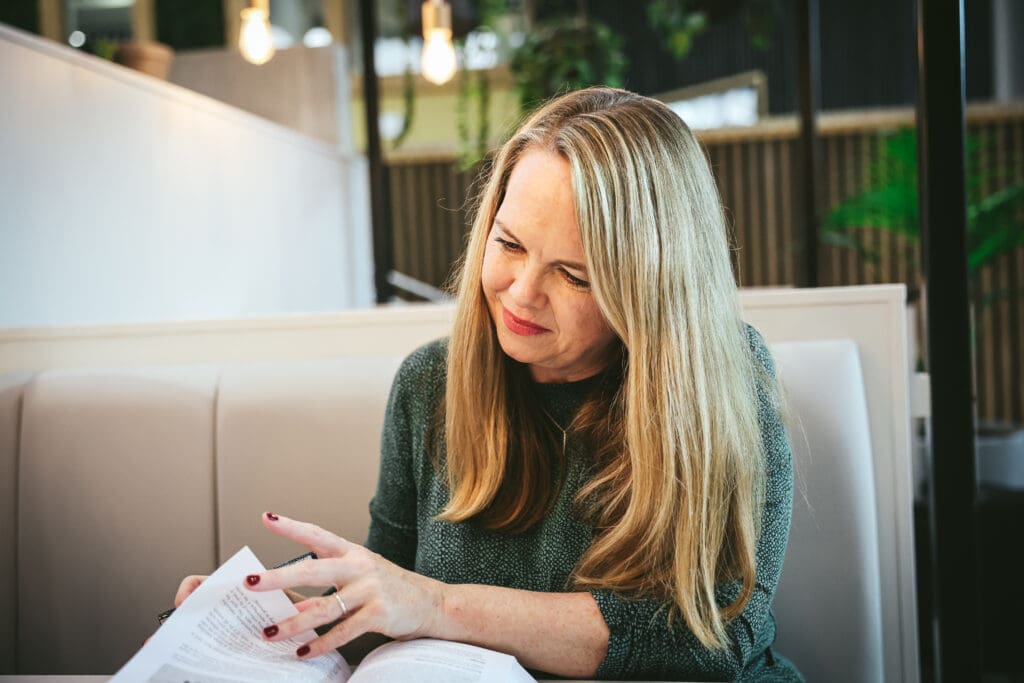 Melinda McDougall, reading herbal book